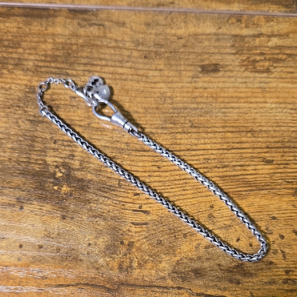 Silver chain bracelet with charms